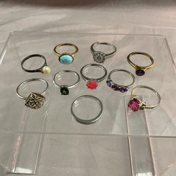 Assorted 925 silver rings displayed for sale.