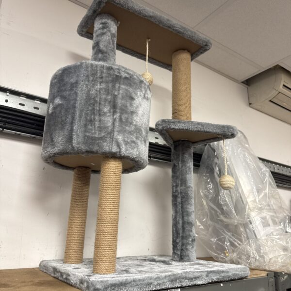 Multi-level cat tree with plush platforms and sisal scratching posts.