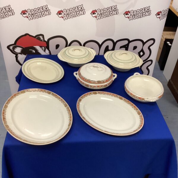 Vintage Burslem serving dishes with floral pattern on display.