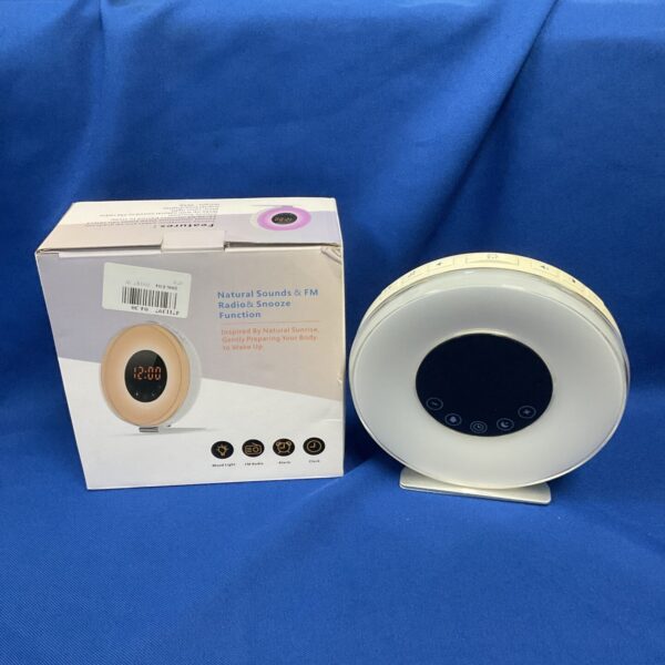 Digital alarm clock radio with a clear display and controls.