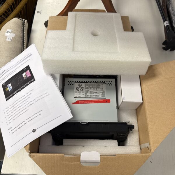 Dynavin car stereo kit with cables and mounting hardware.