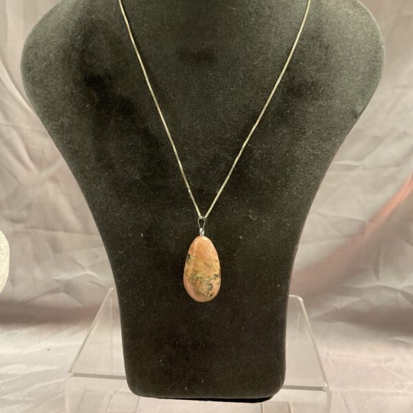 Silver stone pendant necklace on a delicate chain.