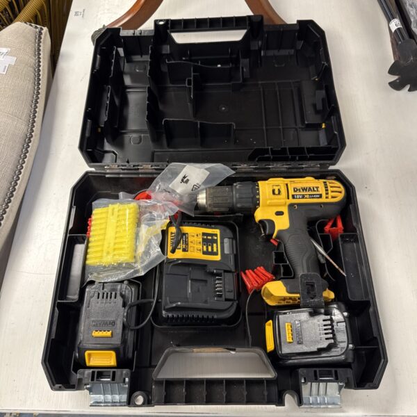 Dewalt XR cordless drill set in open carrying case.