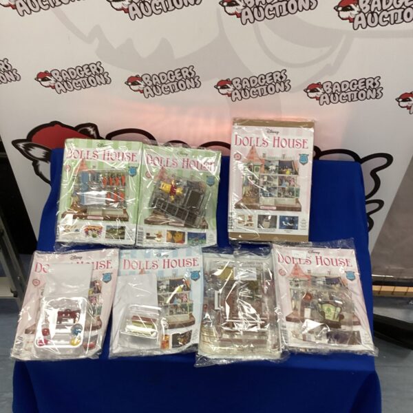 Sealed Disney dolls house kits in plastic bags.