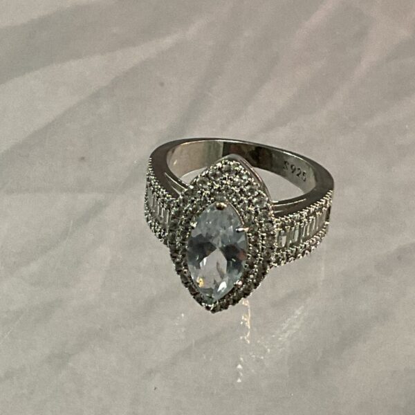 Pale blue stone set in a vintage silver ring.