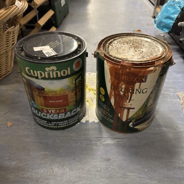 Two tins of Cuprinol decking paint for garden wood protection.