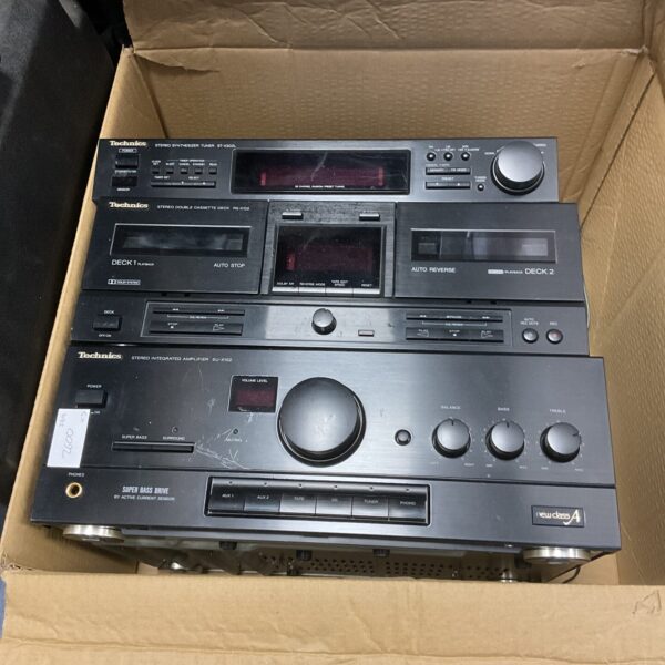 Front view of a vintage Technics HiFi system with amplifier and cassette deck.