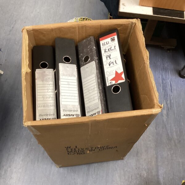Large quantity of dark coloured lever arch files for document storage.