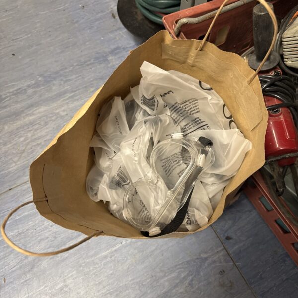 Bag of new laif safety goggles for work or protection.