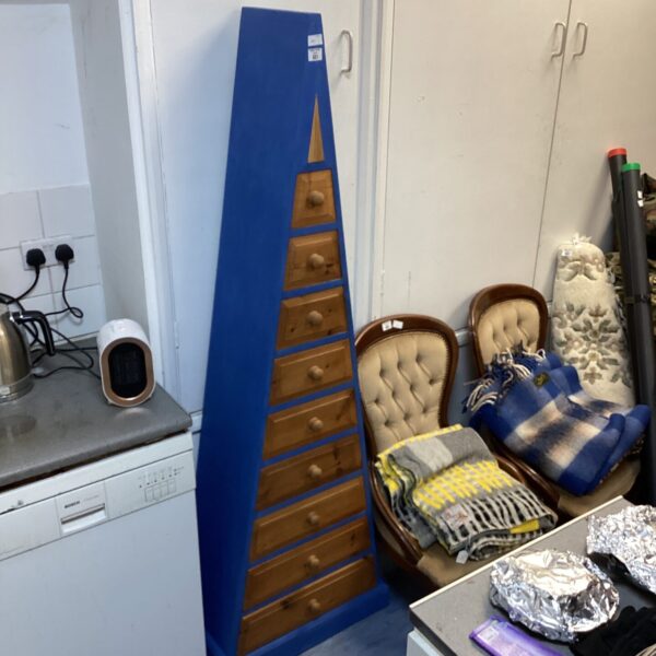Vintage triangular chest of drawers with painted finish.