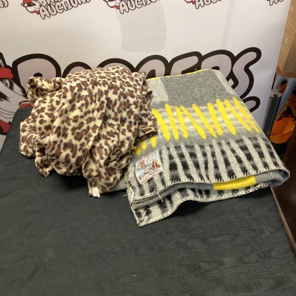 Vintage leopard print travel blanket, a cozy wool throw.