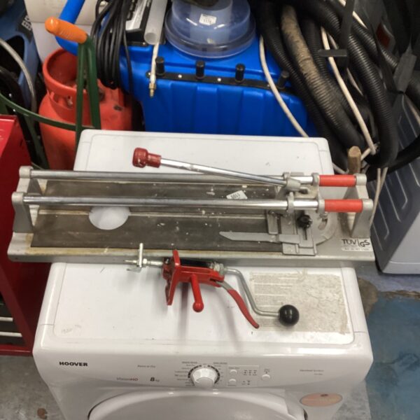 Used TUV tile cutter for manual tile cutting and flooring projects.