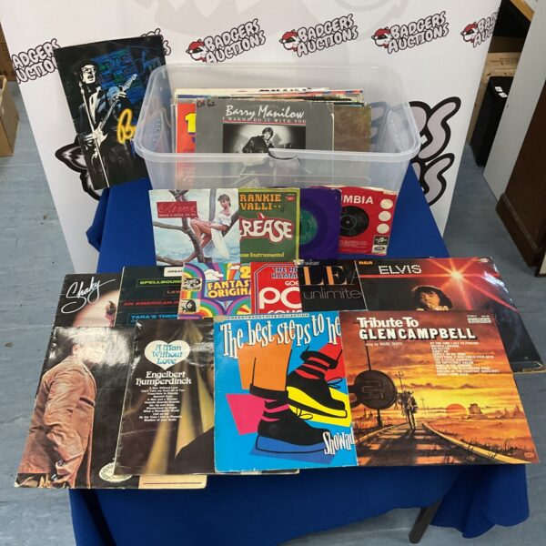 Vintage vinyl record lot featuring Elvis Presley and other artists.