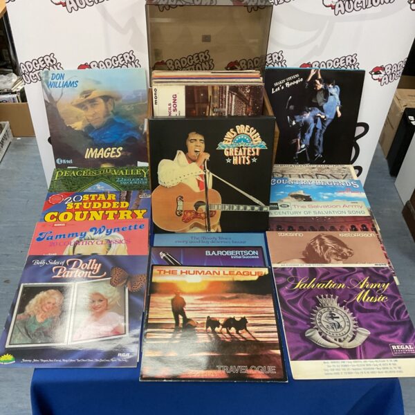 Vintage vinyl record collection featuring Elvis and The Human League.