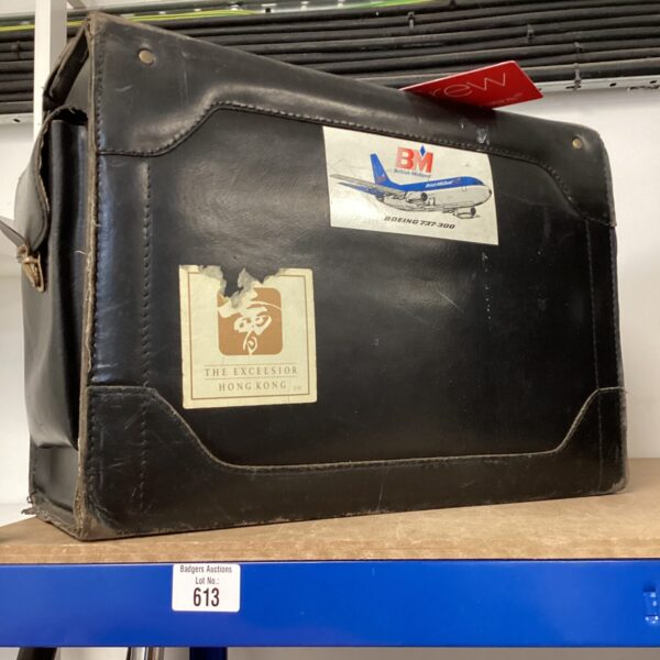 Vintage black leather pilots case with Boeing 737 emblem.