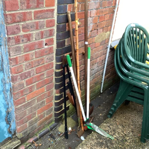 Selection of vintage garden tools including loppers and spade.