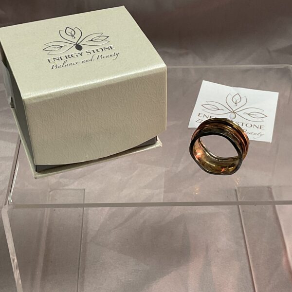 Silver spinner ring with copper and brass bands, size V.