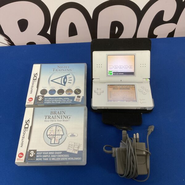 Nintendo DS Lite console with games and charger presented.
