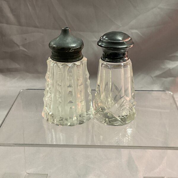 Antique silver mounted salt and vinegar pots with hallmarked silver.