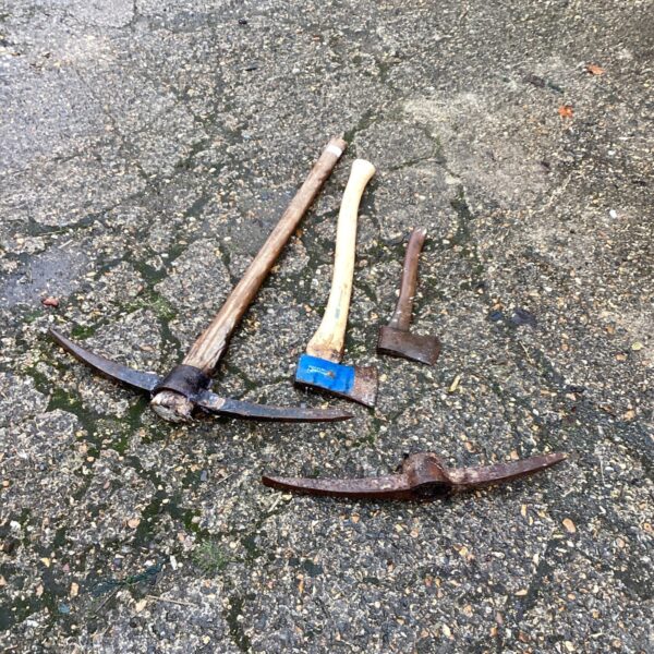Antique pick tools lot including pickaxe and choppers.