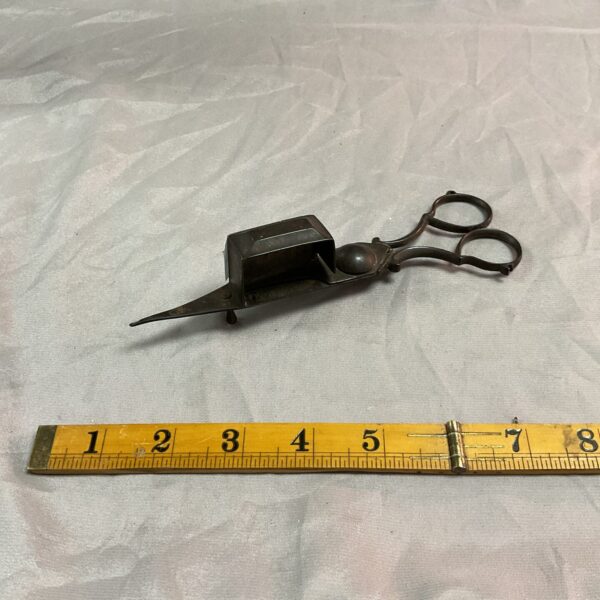 Antique wick trimming scissors for kerosene lamps.