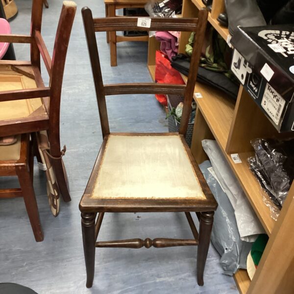 Front view of a vintage Victorian hall chair with wooden frame.