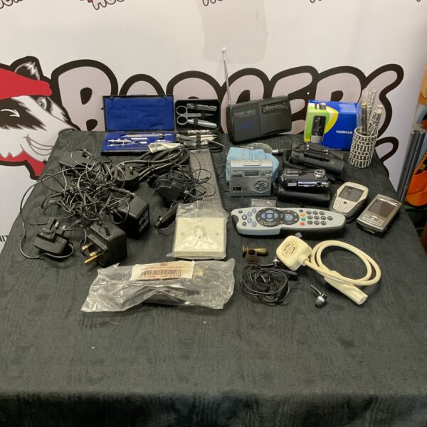 Mixed electronics lot including Nokia phones and a digital camera.