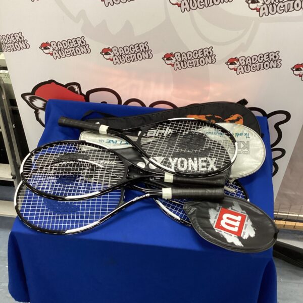 Yonex badminton and tennis rackets in a sports equipment lot.