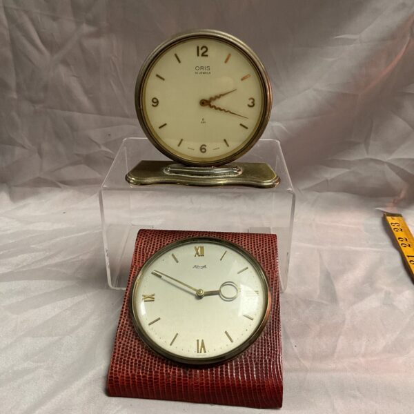 Vintage Kienzle desk clock with a silver case and white dial.