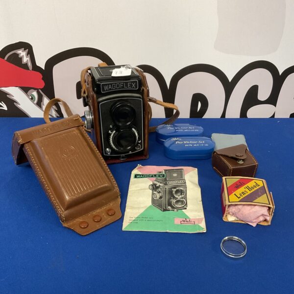 Vintage Walz Wagoflex TLR camera with accessories, a collectible film camera.