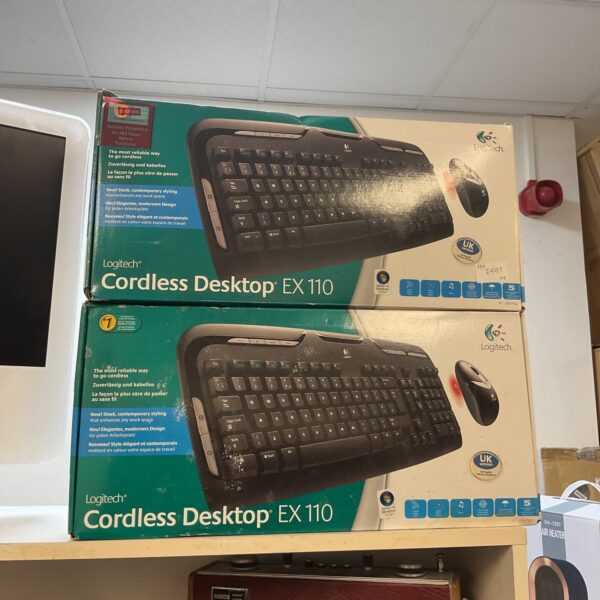 Logitech cordless keyboard and mouse set, vintage computer peripheral.