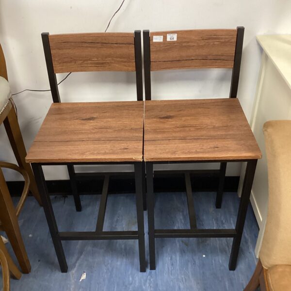 Pair of industrial style metal and wood bar stools.