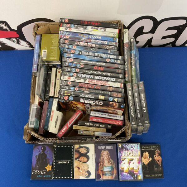 Mixed lot of DVDs, cassettes, and games for collectors.