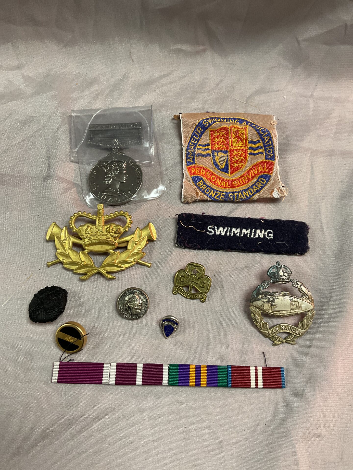 965 Bag of assorted badges and copy Northern Ireland medal