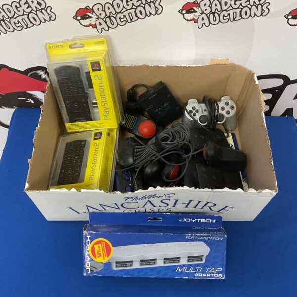 PlayStation accessories lot including light gun and controllers.