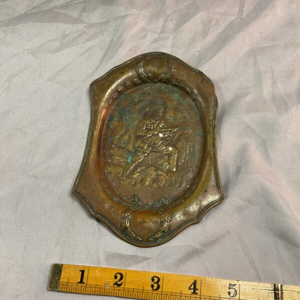 Vintage WW1 copper tray with soldier relief detail.