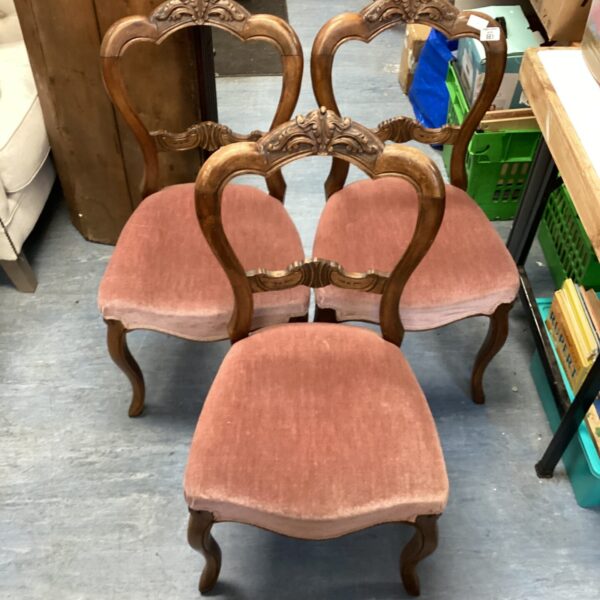 Set of three antique Victorian walnut balloon back chairs.