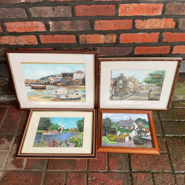 Watercolour painting of boats docked in a harbour scene.