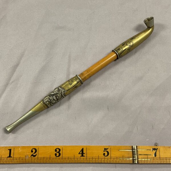 Antique Chinese opium pipe with tiger decoration on ruler.
