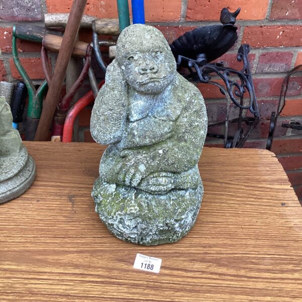 Realistic concrete gorilla garden ornament for outdoor display.