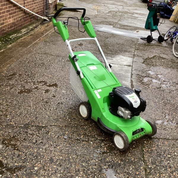 Used Viking petrol lawn mower in a garden setting.