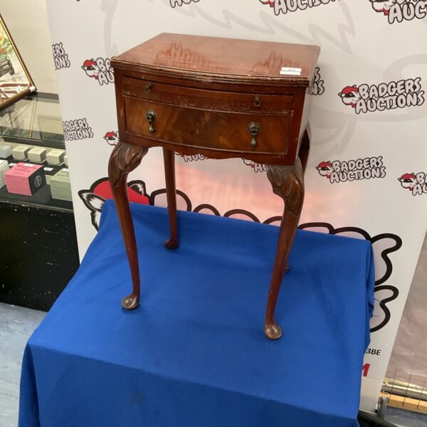 Antique Regency mahogany bedside cabinet on blue backdrop.