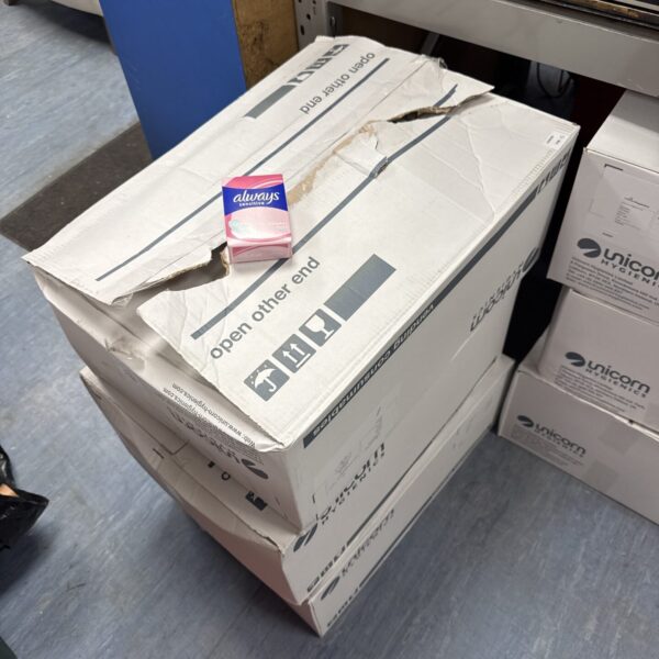 Wholesale lot of Always sanitary towels in cardboard boxes.