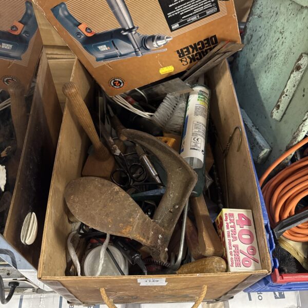 Assorted tools and hardware from a shed clearance lot.