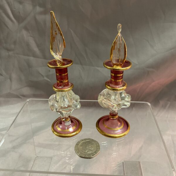 Pair of antique Bohemian glass scent bottles with red and gold accents.