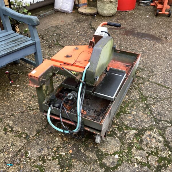 Husqvarna industrial cutter with water cooling system.