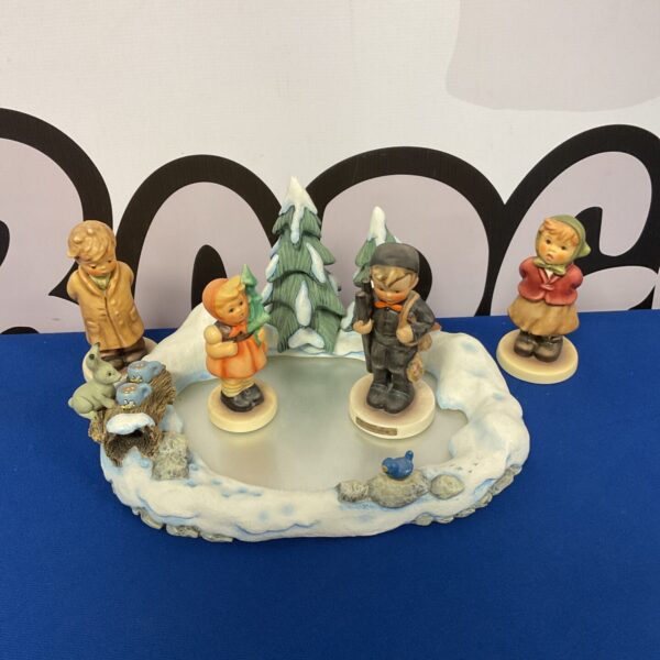 Vintage Goebel Hummel Icy Adventure figurine with chimney sweep.