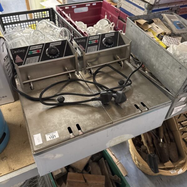 Front view of a stainless steel commercial food fryer.