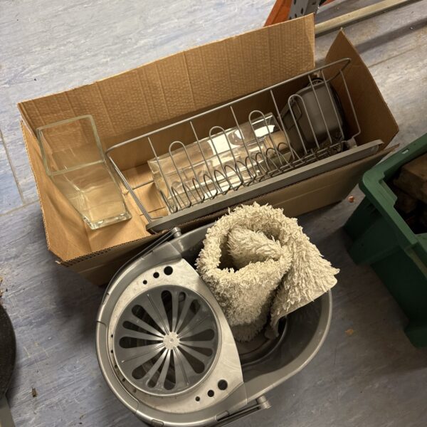 Cleaning and storage lot including mop bucket and vases.