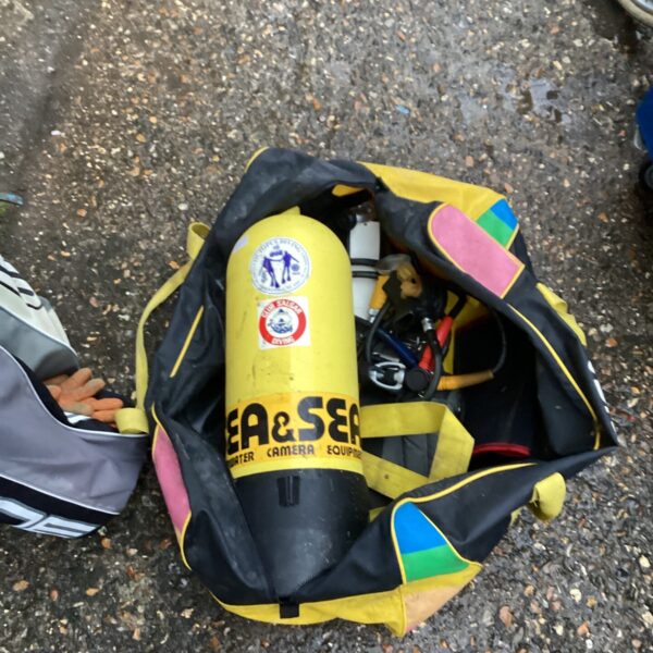 Divers tank and equipment inside a carrying bag.